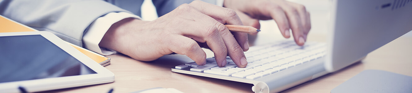 Photo of a woman working on her computer.