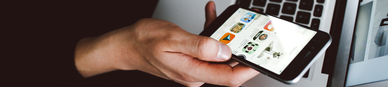 Photo of a woman holding her cell phone