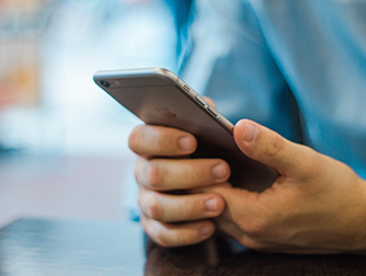 A man looking at his cell phone