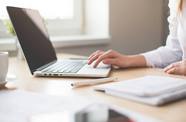 A woman working on a laptop computer