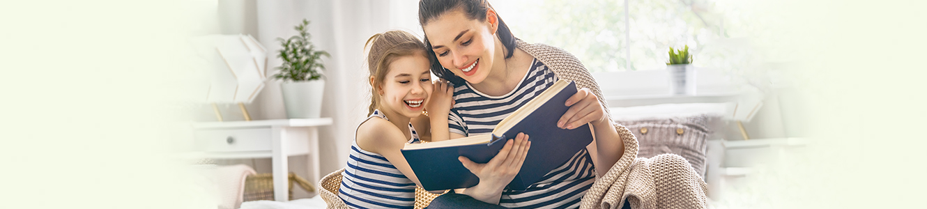 Mother and daughter reading a book